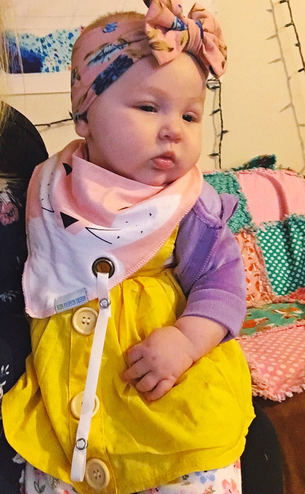 Danica is registered to the contest to win money with this photo: baby, cheek, child, head, neck, outerwear, person, play, product, smile, toddler, yellow