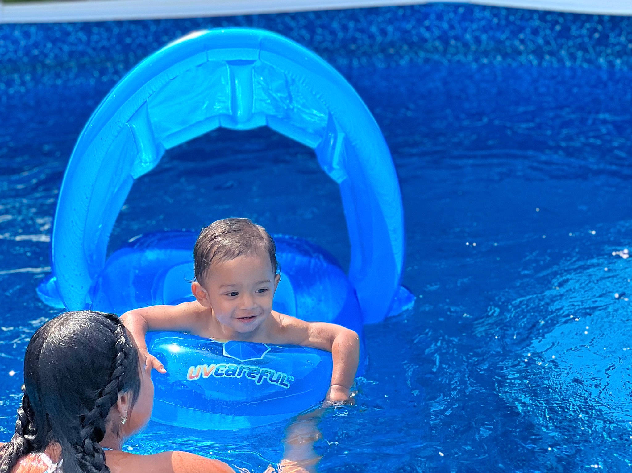 Zoriel is registered to the contest to win money with this photo: aqua, azure, bathing, blue, child, electric_blue, fluid, fun, games, happy, inflatable, joy, leisure, outdoor_recreation, person, play, recreation, smile, swimming_pool, toddler