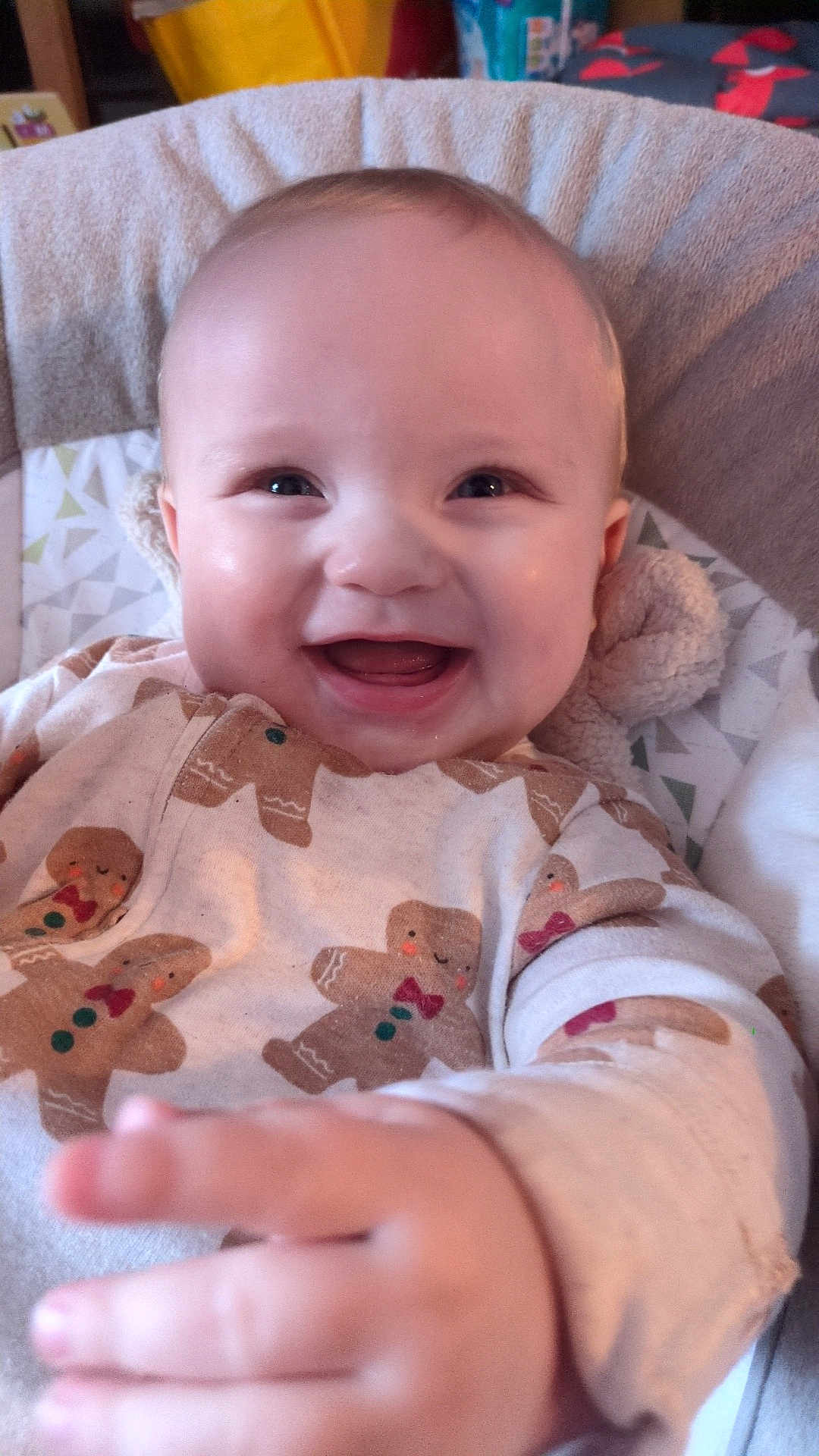 Casper joined the competition — help win amazing prizes! baby, smiling, happy, child, infant, face, hand, clothing, gingerbread_men, onesie, indoors, soft_toy, seat, cute, portrait, closeup, cozy, warm, cheerful, baby_girl