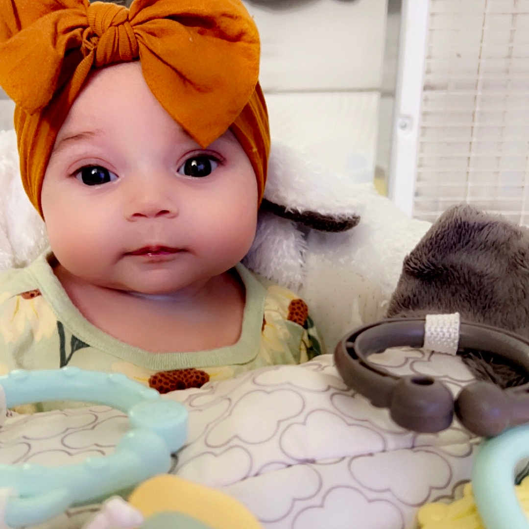 Paisley joined the competition — help win amazing prizes! adult, baby, bed, bonnet, cap, clothing, couch, crib, doll, face, female, furniture, hat, head, infantbed, person, photography, portrait, toy, woman