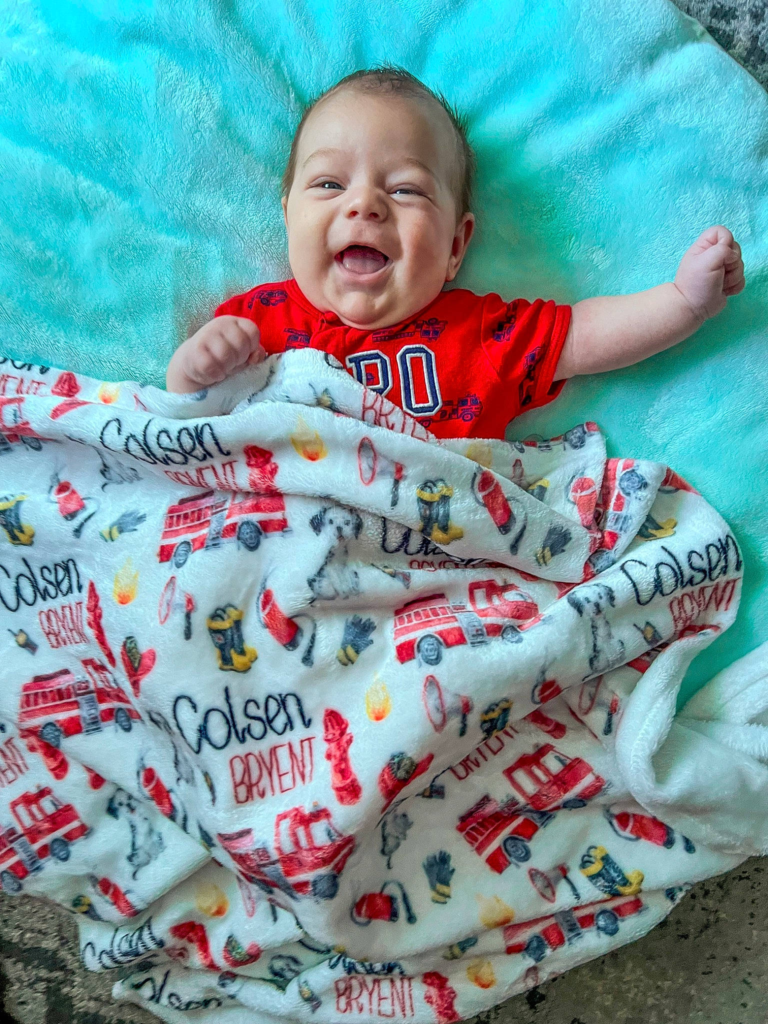Colsen is registered to the contest to win money with this photo: baby, baby_products, baby_toddler_clothing, child, comfort, event, face, grass, happy, head, linens, pattern, person, pink, sitting, sleeve, smile, t_shirt, textile, toddler