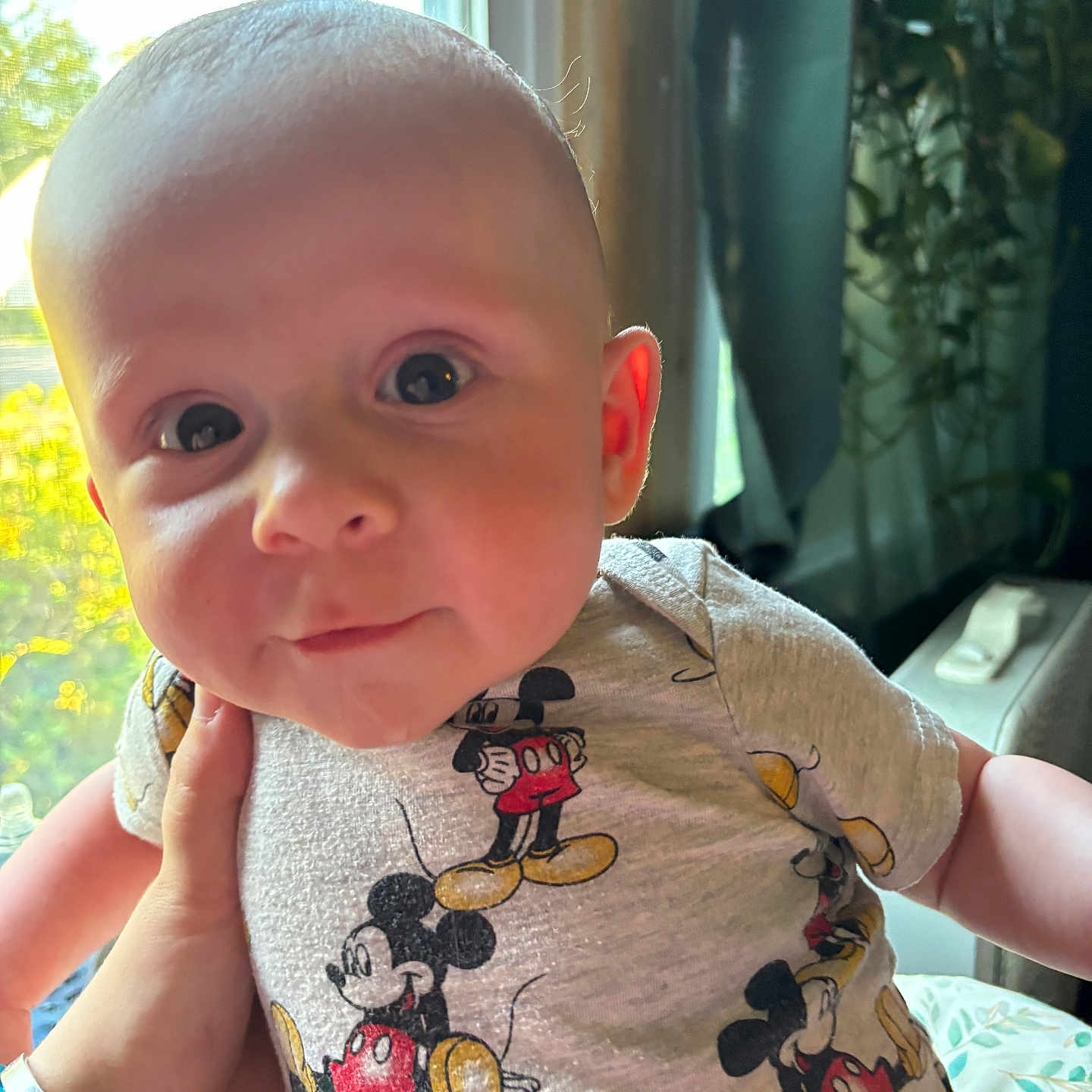 Rhonin joined the competition — help win amazing prizes! baby, child, clothing, cute, expression, eyes, face, hand, holding, indoors, infant, mickey_mouse, natural_light, person, portrait, shirt, skin, soft_light, window, young