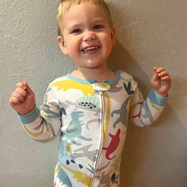 Kash is registered to the contest to win money with this photo: baby, babylaughing, blonde, bodypart, clothing, face, finger, hair, hand, happy, head, laughing, pajamas, pants, person, photography, portrait, sleeve, smile, triumphant