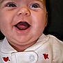 Annastasie is registered to the contest to win money with this photo: baby, infant, smile, open_mouth, chubby_cheeks, close_up, portrait, onesie, heart_pattern, clothing, cute, joyful, happy, human, face, eyes, tongue, neck, soft_skin, collar