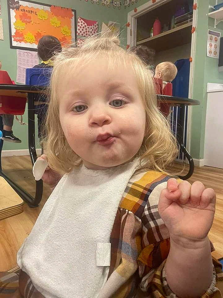 Aloura is registered to the contest to win money with this photo: baby, baby_toddler_clothing, chair, cheek, child, fun, gesture, happy, pattern, person, picture_frame, plaid, room, shelf, skin, tartan, thumb, toddler, toy, wood