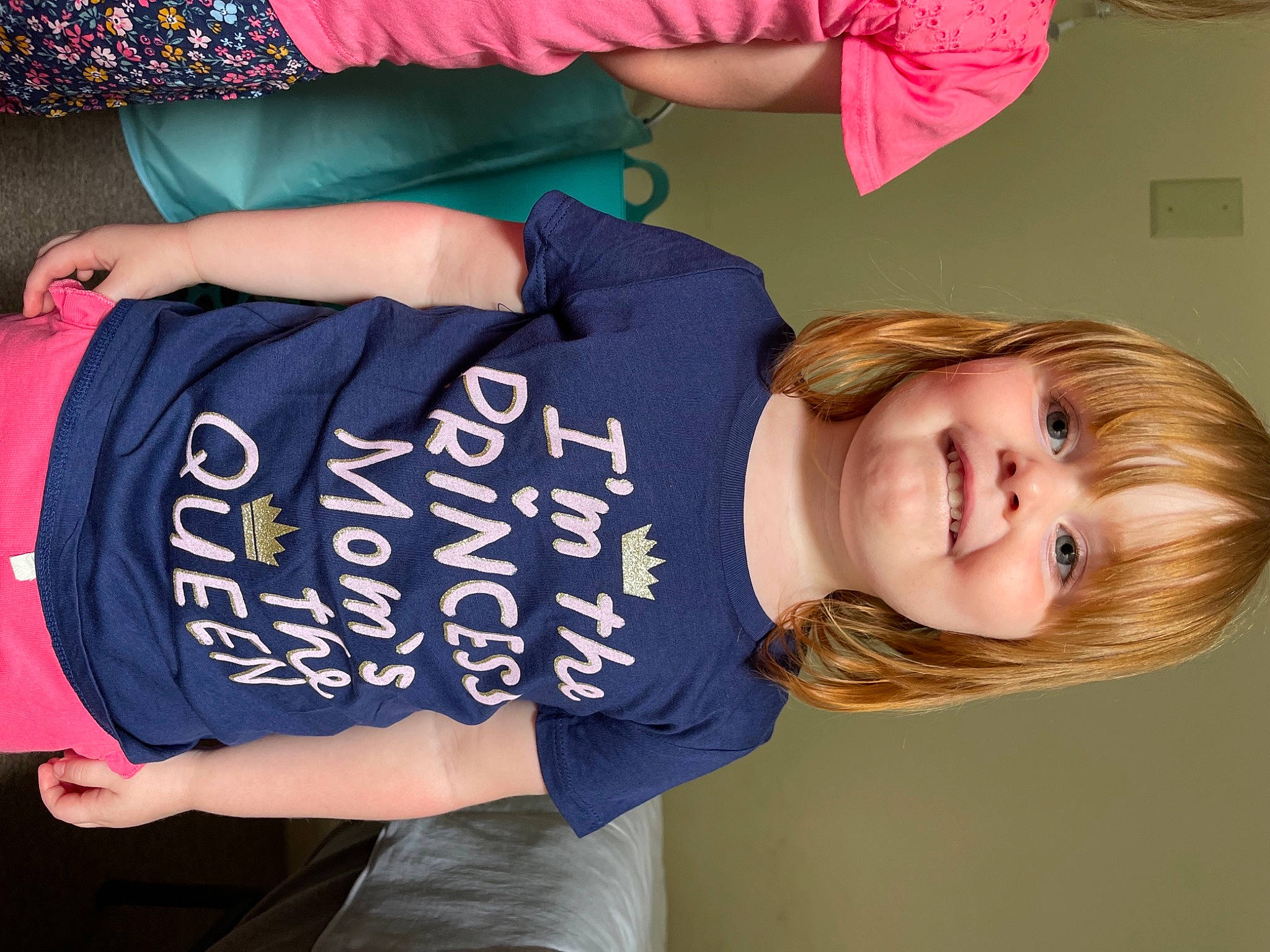 Stella joined the competition — help win amazing prizes! arm, child, clothing, elbow, electric_blue, finger, font, fun, hair_coloring, handwriting, happy, joint, joy, magenta, pattern, person, sitting, sleeve, smile, t_shirt