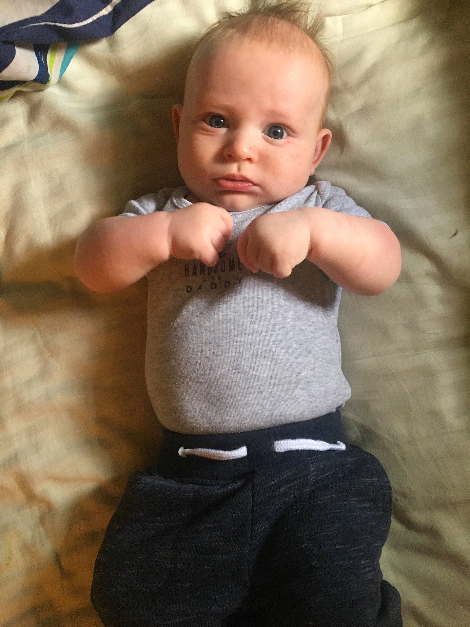 Iverson is registered to the contest to win money with this photo: arm, baby, blond, cheek, child, eye, face, head, joint, male, muscle, nose, person, sitting, skin, smile, toddler