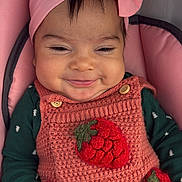 Mariane joined the competition — help win amazing prizes! baby, infant, smile, headband, bow, knitted_dress, strawberry, pink, green, cushion, seat, clothing, hand, cute, happy, face, portrait, indoors, child, young