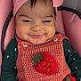 baby, infant, smile, headband, bow, knitted_dress, strawberry, pink, green, cushion, seat, clothing, hand, cute, happy, face, portrait, indoors, child, young