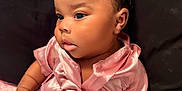 Jream joined the competition — help win amazing prizes! baby, child, infant, pink_dress, hair_bow, face, portrait, cute, indoors, soft_texture, blanket, cushion, seated, skin, hand, expression, young, adorable, clothing, closeup