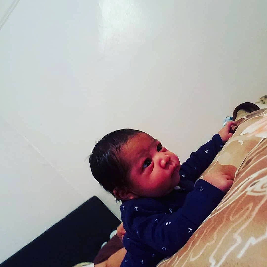 Dariel is registered to the contest to win money with this photo: arm, baby, child, cloud, cool, ear, electronic_device, eye, happy, person, photography, sitting, snapshot, technology, toddler