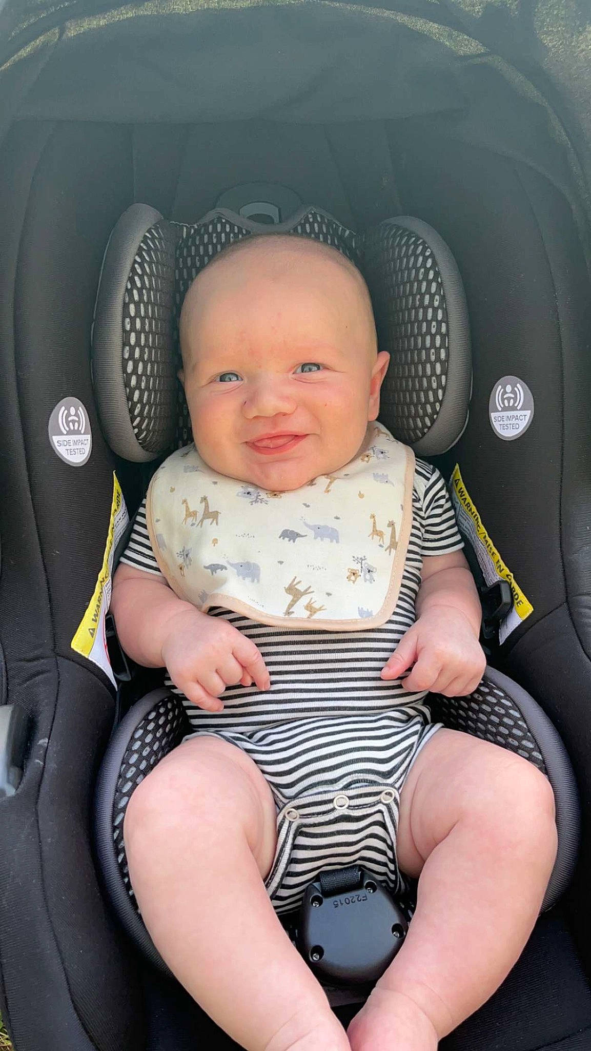 Daniel joined the competition — help win amazing prizes! auto_part, automotive_design, baby, baby_products, baby_toddler_clothing, black, car_seat, car_seat_cover, chair, child, comfort, facial_expression, head, head_restraint, person, product, seat_belt, sitting, smile, thigh