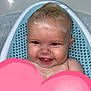 baby, bath, bathtub, water, foam, blue_bath_support, smile, happy, child, skin, head, face, wet_hair, infant, cute, indoors, person, playful, pink_heart, sitting