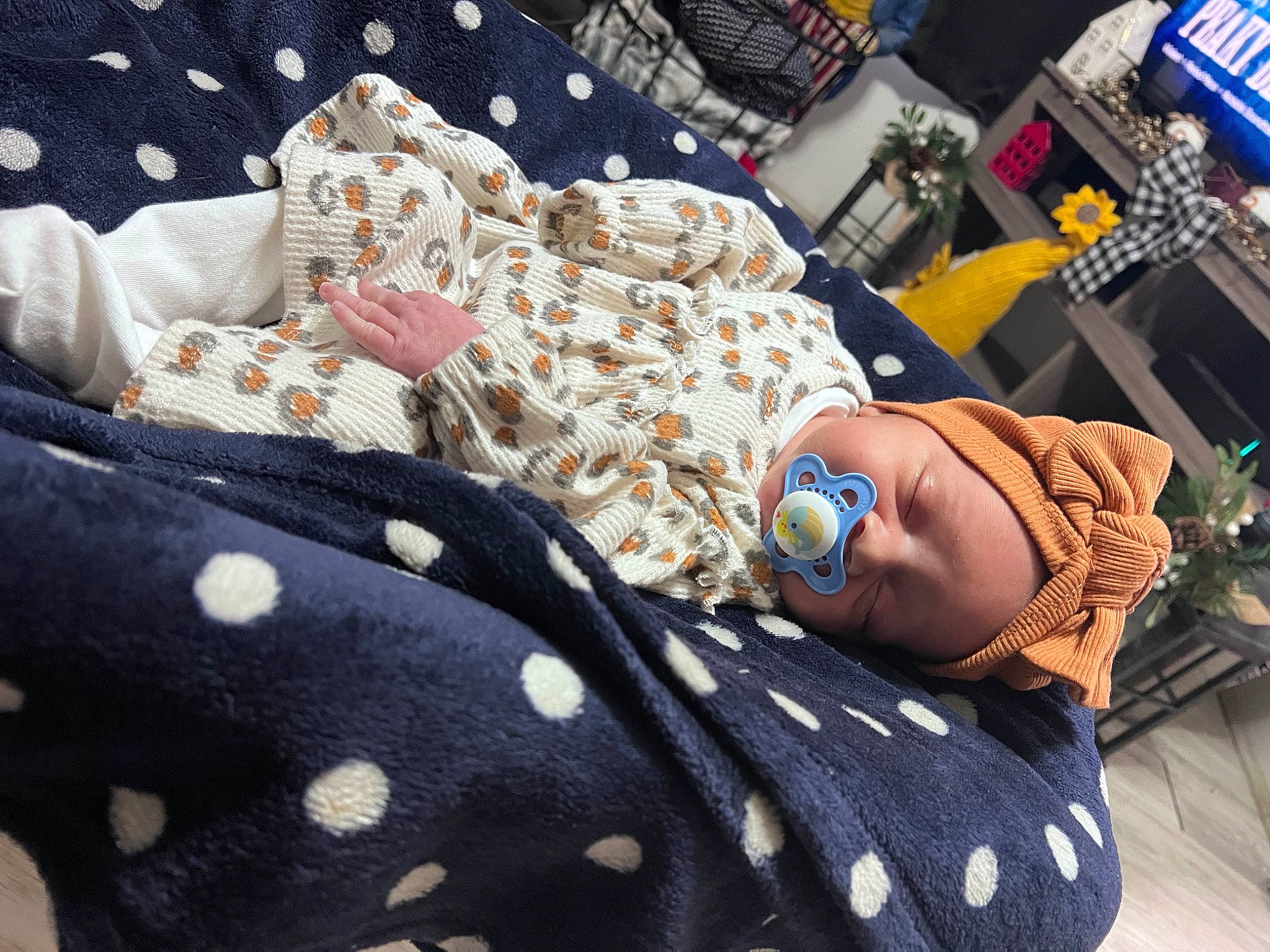 Leilani is registered to the contest to win money with this photo: baby_toddler_clothing, bedding, blanket, child, comfort, couch, eyewear, fashion_accessory, hat, human_leg, jewellery, linens, nap, pattern, person, room, sitting, sunglasses, textile, thigh