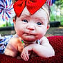 baby, child, red_bow, blue_eyes, blanket, outdoor, pinwheel, headband, face, closeup, portrait, infant, cute, smiling, skin, hand, resting, colorful, summer, nature