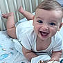 baby, smiling, onesie, bed, crib, plush_toy, giraffe_toy, happy, child, indoor, person, cute, young, infant, face, blue_eyes, blanket, toy, lying_down, toddler