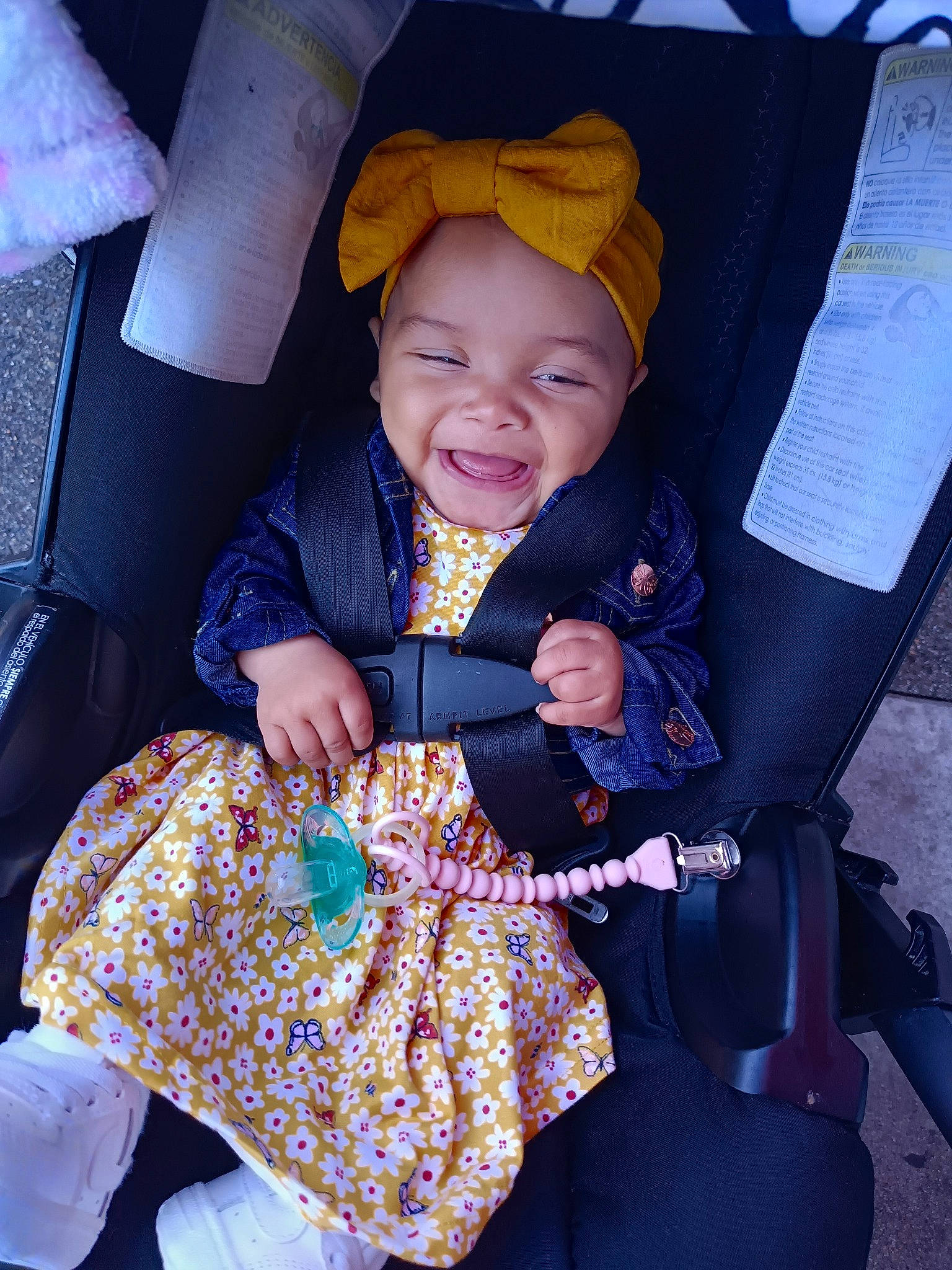 Anabella is registered to the contest to win money with this photo: baby, baby_carriage, baby_products, baby_toddler_clothing, car_seat, child, comfort, electric_blue, event, fashion_accessory, fun, happy, headwear, human, lap, person, pink, purple, sitting, smile