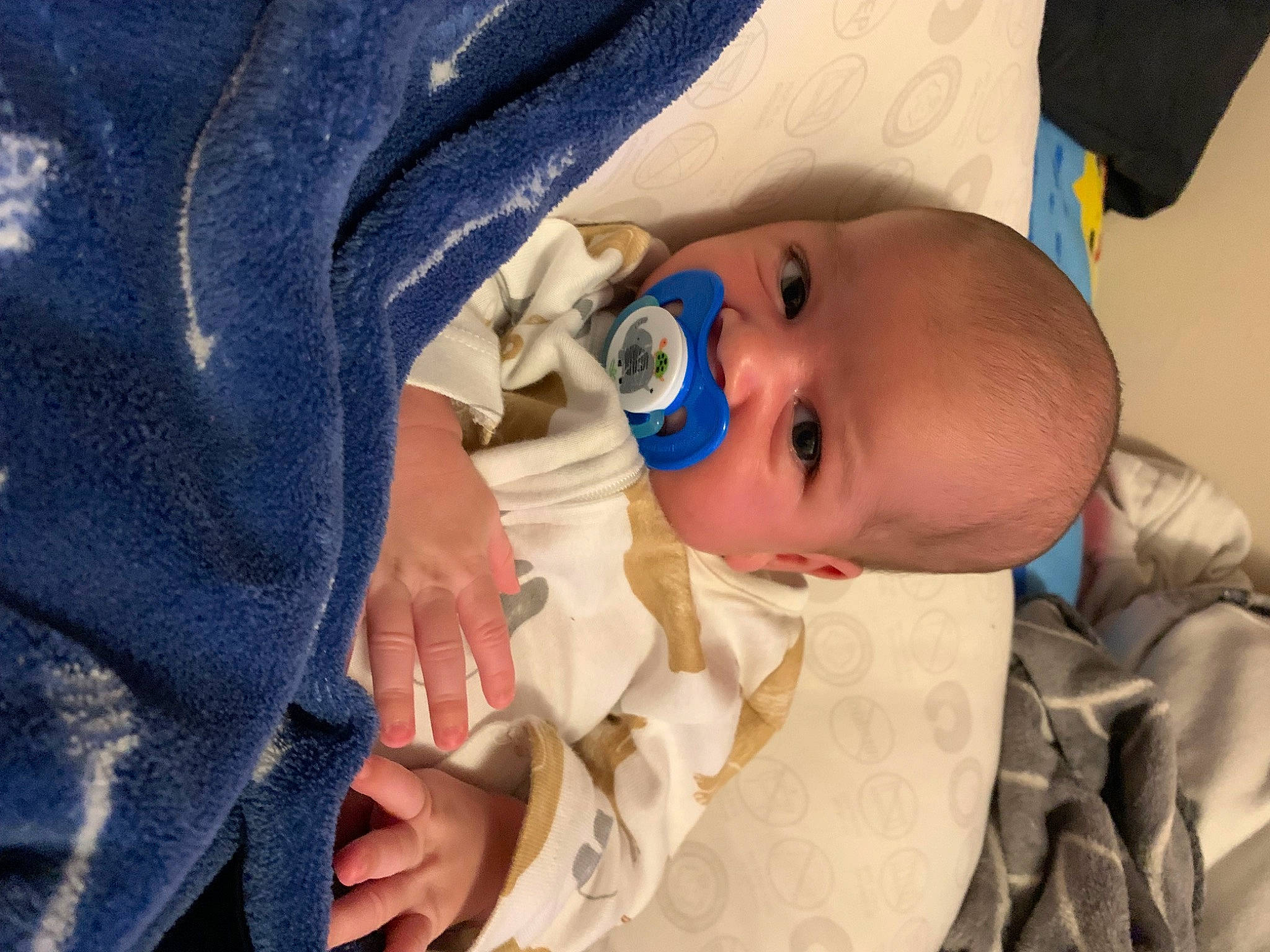 Emerson is registered to the contest to win money with this photo: baby, baby_products, baby_safety, baby_toddler_clothing, cheek, child, comfort, electric_blue, eye, finger, gesture, hat, iris, linens, nail, person, skin, sleeve, textile, thumb