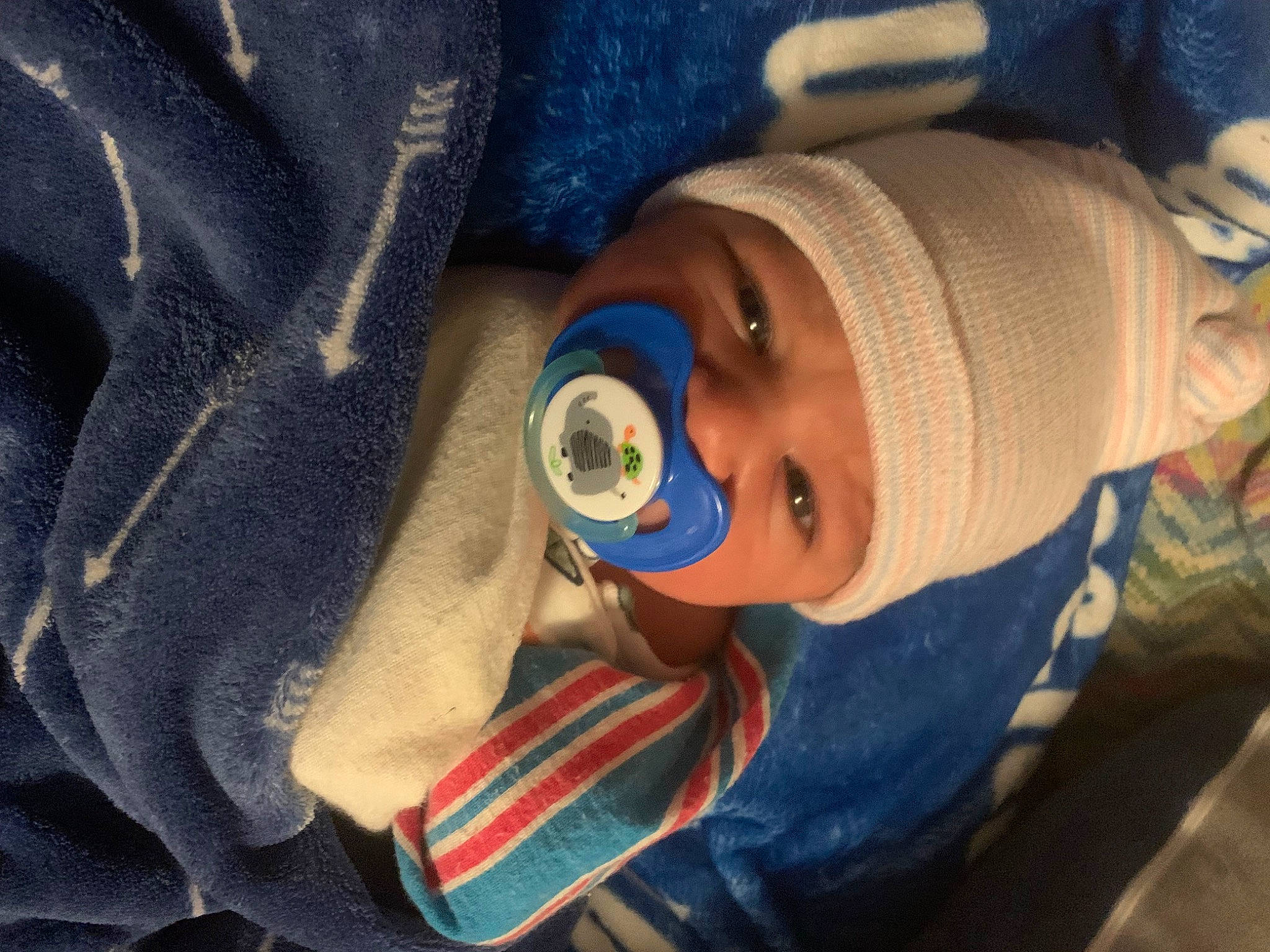 Emerson is registered to the contest to win money with this photo: baby, baby_products, baby_toddler_clothing, beanie, cap, carmine, cheek, child, comfort, cool, electric_blue, hat, headwear, knit_cap, linens, nail, nose, person, personal_protective_equipment, sleeve