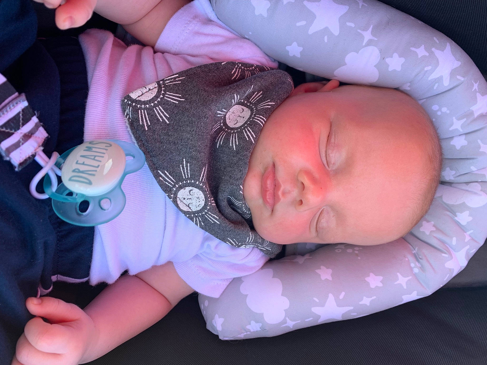 Parker is registered to the contest to win money with this photo: baby, baby_products, baby_sleeping, baby_toddler_clothing, cheek, child, comfort, eyelash, finger, hand, mouth, nail, pattern, person, pink, purple, skin, sleeve, thumb, toddler