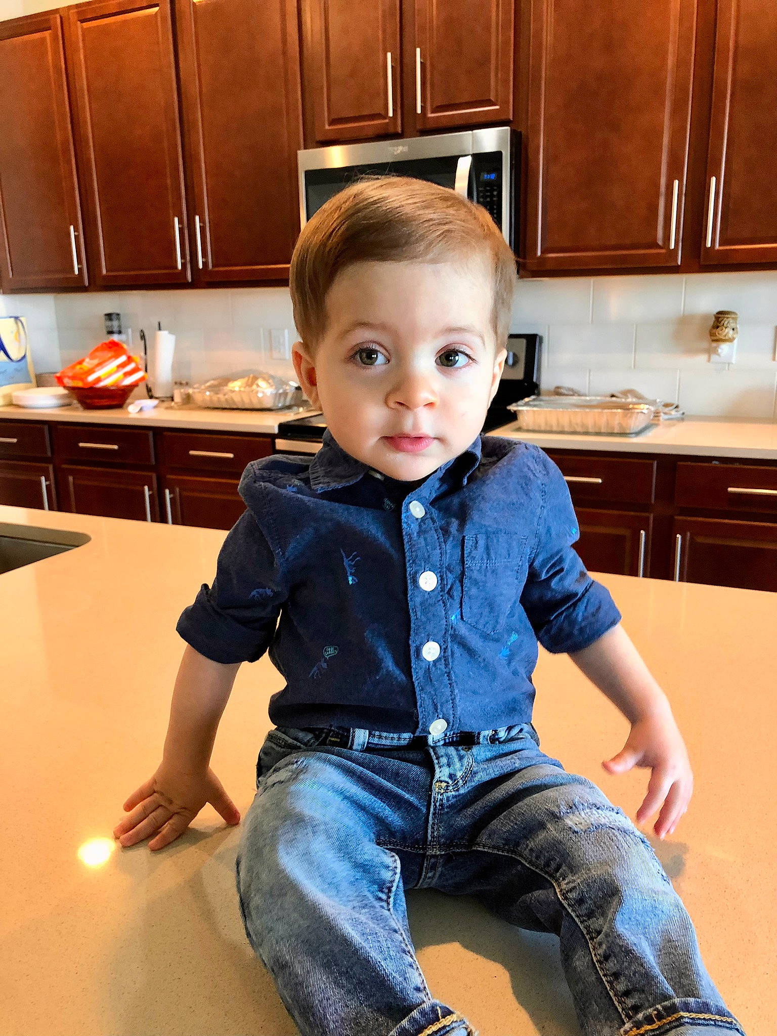Joshua joined the competition — help win amazing prizes! baby_toddler_clothing, cabinetry, countertop, cupboard, drawer, dress_shirt, floor, flooring, furniture, jeans, kitchen, kitchen_appliance, light, person, sleeve, standing, t_shirt, table, toddler, white
