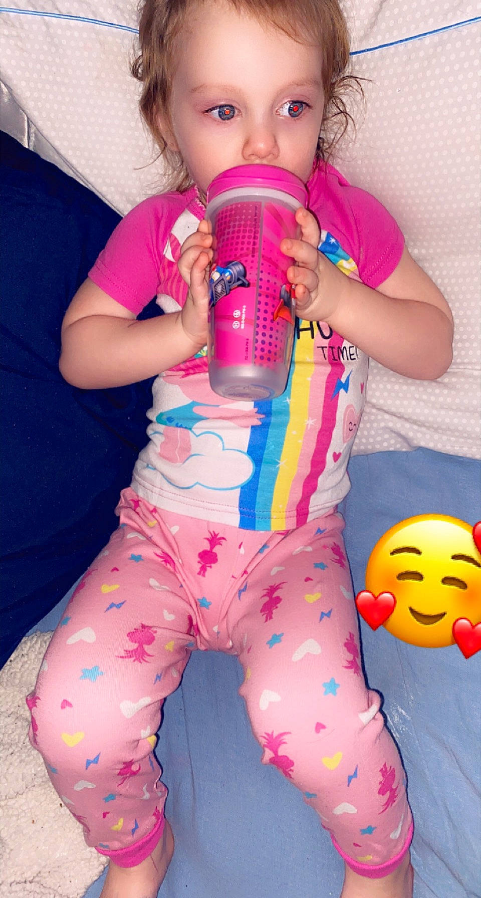 Davina is registered to the contest to win money with this photo: baby_toddler_clothing, chest, drinking, drinkware, face, finger, fun, happy, lip, magenta, mouth, nail, organ, person, pink, plastic_bottle, red, skin, smile, thigh