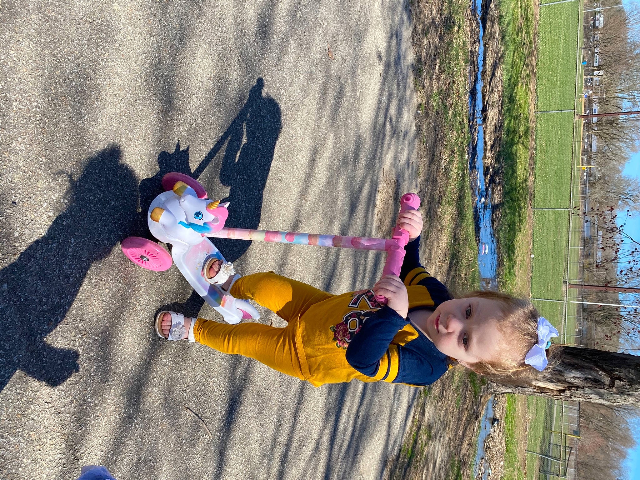 Davina is registered to the contest to win money with this photo: adventure, climbing_harness, extreme_sport, fictional_character, fun, grass, leisure, outdoor_play_equipment, people_in_nature, person, plant, recreation, rope, sky, slope, toddler, tree, twig, winter