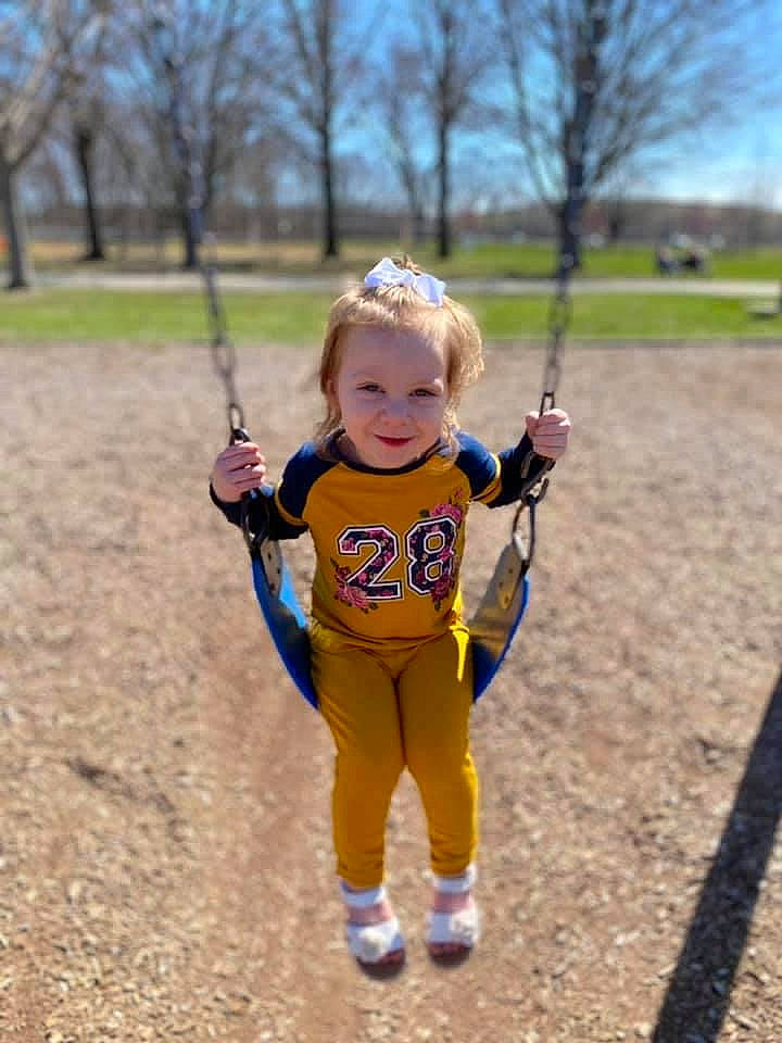 Davina joined the competition — help win amazing prizes! child, electric_blue, eye, face, grass, happy, joy, leisure, outdoor_play_equipment, people_in_nature, person, plant, playground, recreation, running, sky, sleeve, smile, soil, swing