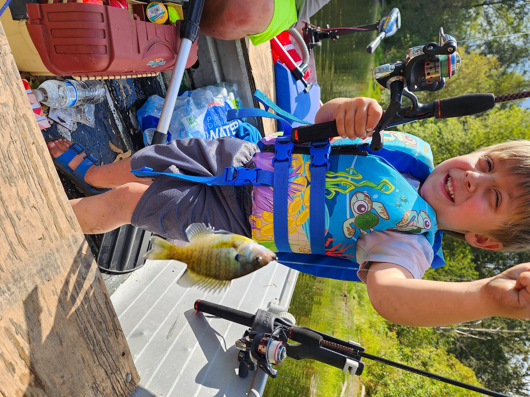 Korbin joined the competition — help win amazing prizes! bicycle_frame, bicycle_handlebar, child, fun, grass, leisure, person, personal_protective_equipment, plant, recreation, shorts, smile, sunglasses, t_shirt, toddler, tree, vacation