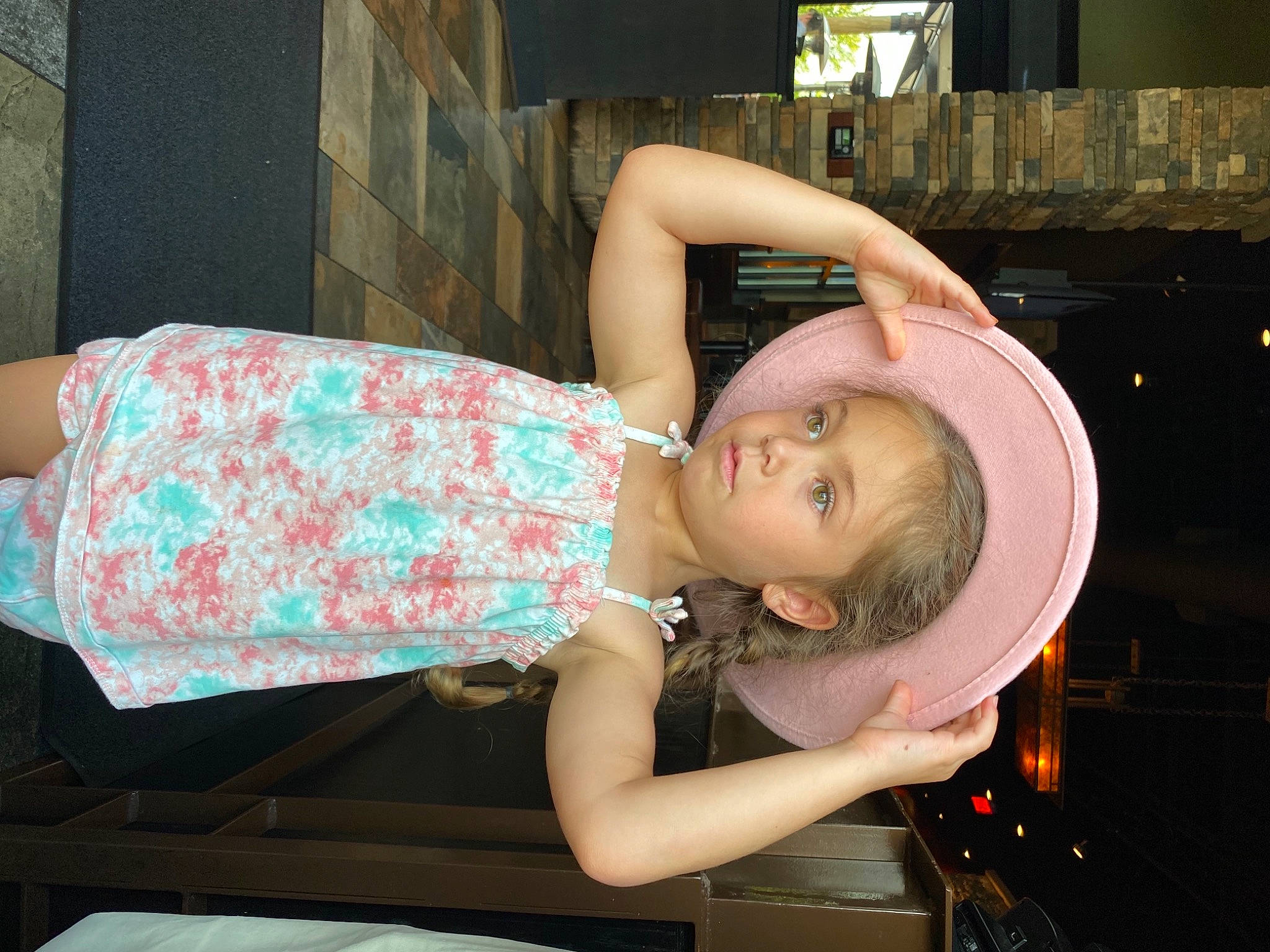 Katalina is registered to the contest to win money with this photo: arm, auto_part, chest, child, dress, eyelash, eyewear, fashion_accessory, flash_photography, fun, hand, helmet, human_leg, jewellery, pattern, person, pink, sitting, thigh, toddler