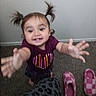 baby, carpet, child, clothing, face, floor, hair, hands, happy, home, indoor, pigtails, pink_shoes, playful, portrait, reaching, shirt, slippers, smiling, toddler