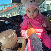 Cataleya-Rianna participe au concours pour gagner de l'argent avec cette photo : baby, child, pink_clothing, hat, minnie_mouse, car_interior, steering_wheel, audi, person, hand, seat, window, daylight, jeans, sock, cute, infant, portrait, car_dashboard, holding