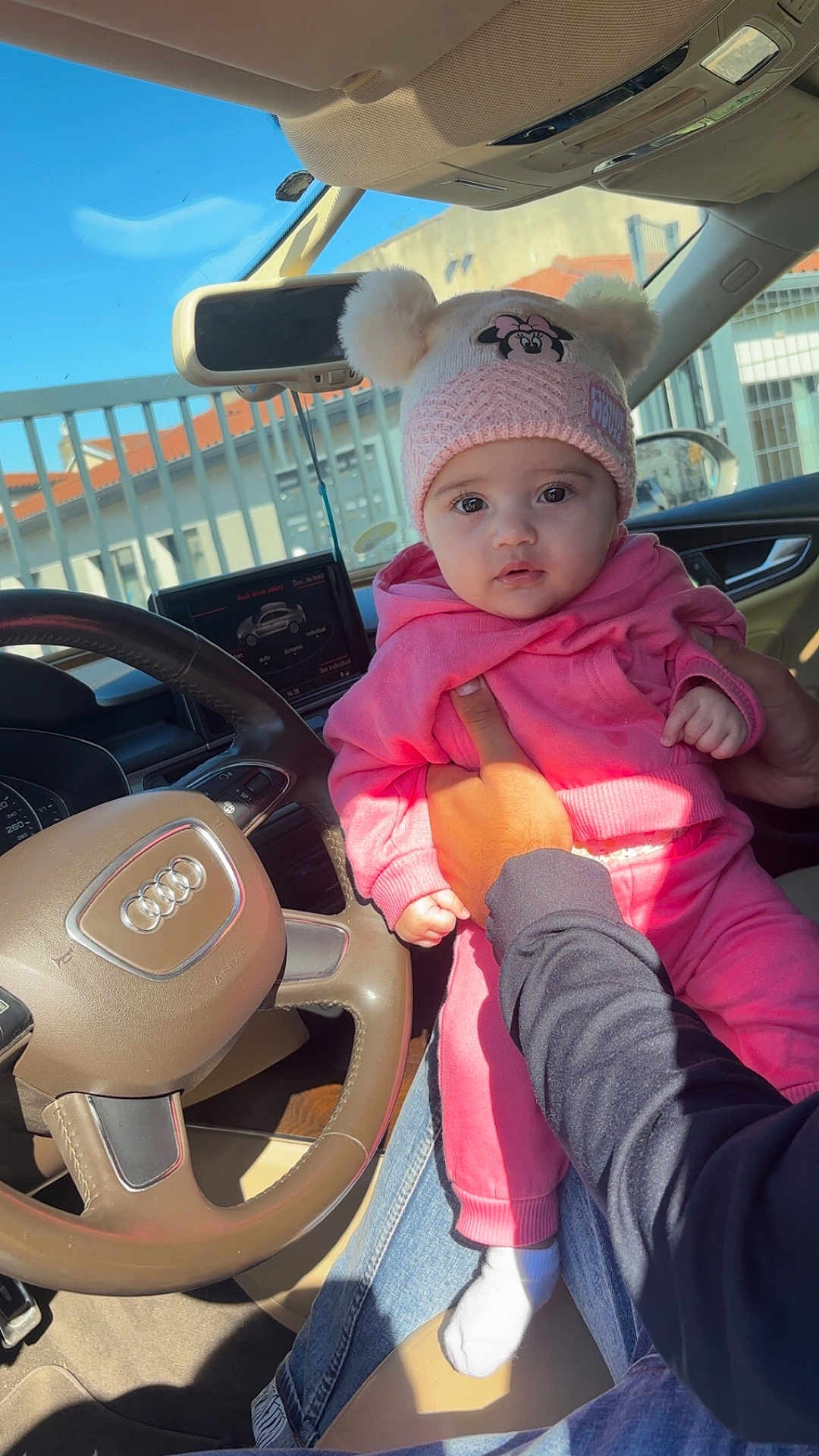Cataleya-Rianna participe au concours pour gagner de l'argent avec cette photo : baby, child, pink_clothing, hat, minnie_mouse, car_interior, steering_wheel, audi, person, hand, seat, window, daylight, jeans, sock, cute, infant, portrait, car_dashboard, holding
