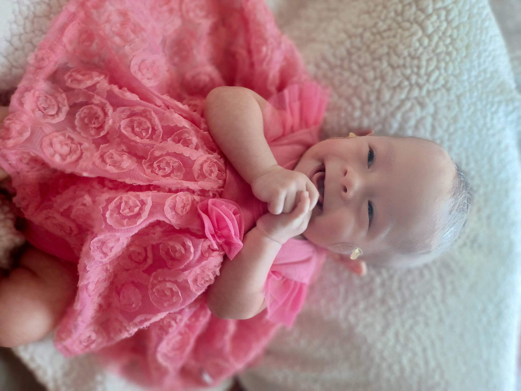 Mylah is registered to the contest to win money with this photo: arm, baby, baby_toddler_clothing, cheek, child, comfort, creative_arts, dress, embellishment, hair_accessory, linens, lip, magenta, nail, pattern, person, pink, skin, sleeve, textile