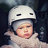 Austin participe au concours pour gagner de l'argent avec cette photo : toddler, child, helmet, car_seat, coat, beanie, blue_eyes, face, safety, straps, winter_clothing, closeup, portrait, indoors, expressionless, warm_clothing, seatbelt, baby, person, headgear