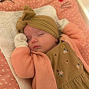 Céleste participe au concours pour gagner de l'argent avec cette photo : baby, sleeping, headwrap, pink, cardigan, blanket, pattern, cute, cozy, infant, toddler, soft, comfortable, resting, child, portrait, indoors, peaceful, clothing, nap