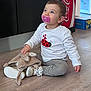 Léonie participe au concours pour gagner de l'argent avec cette photo : blue_eyes, box, child, clothing, coca_cola, cute, floor, gaze, hardwood_floor, indoor, ladybug_shirt, pacifier, plush_toy, portrait, shoe, sitting, sneakers, stuffed_animal, toddler, window
