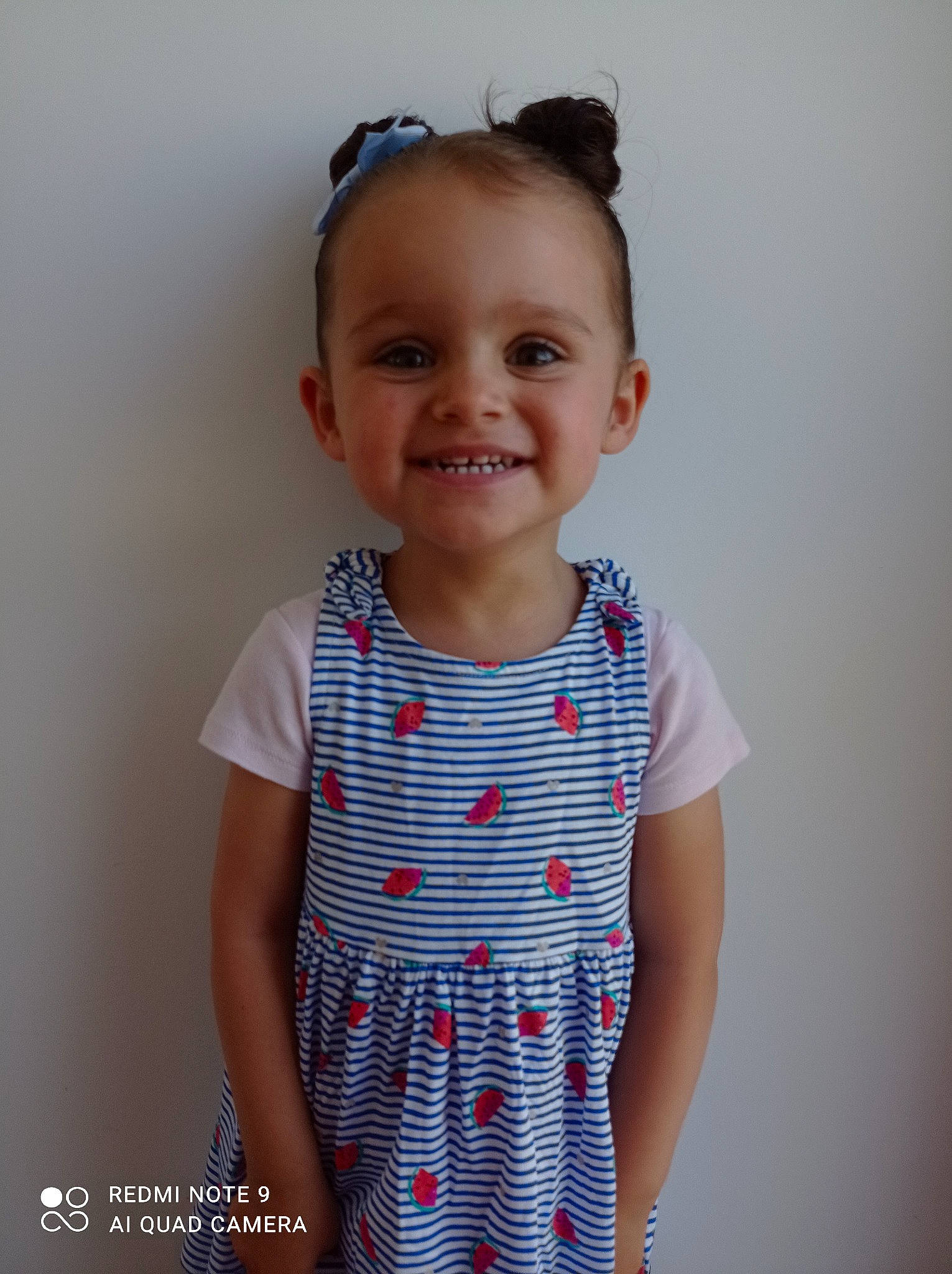 Sofia participe au concours pour gagner de l'argent avec cette photo : arm, baby, baby_toddler_clothing, child, day_dress, electric_blue, gesture, happy, jewellery, joy, neck, one_piece_garment, pattern, person, plaid, product, shoulder, sleeve, smile, standing