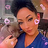 Tanna Boots is registered to the contest to win money with this photo: woman, puppy, dog, pet, outdoor, house, window, blue_clothing, face, hair_updo, hand, holding, cute, filter, hearts, sparkles, smile, portrait, affection, love