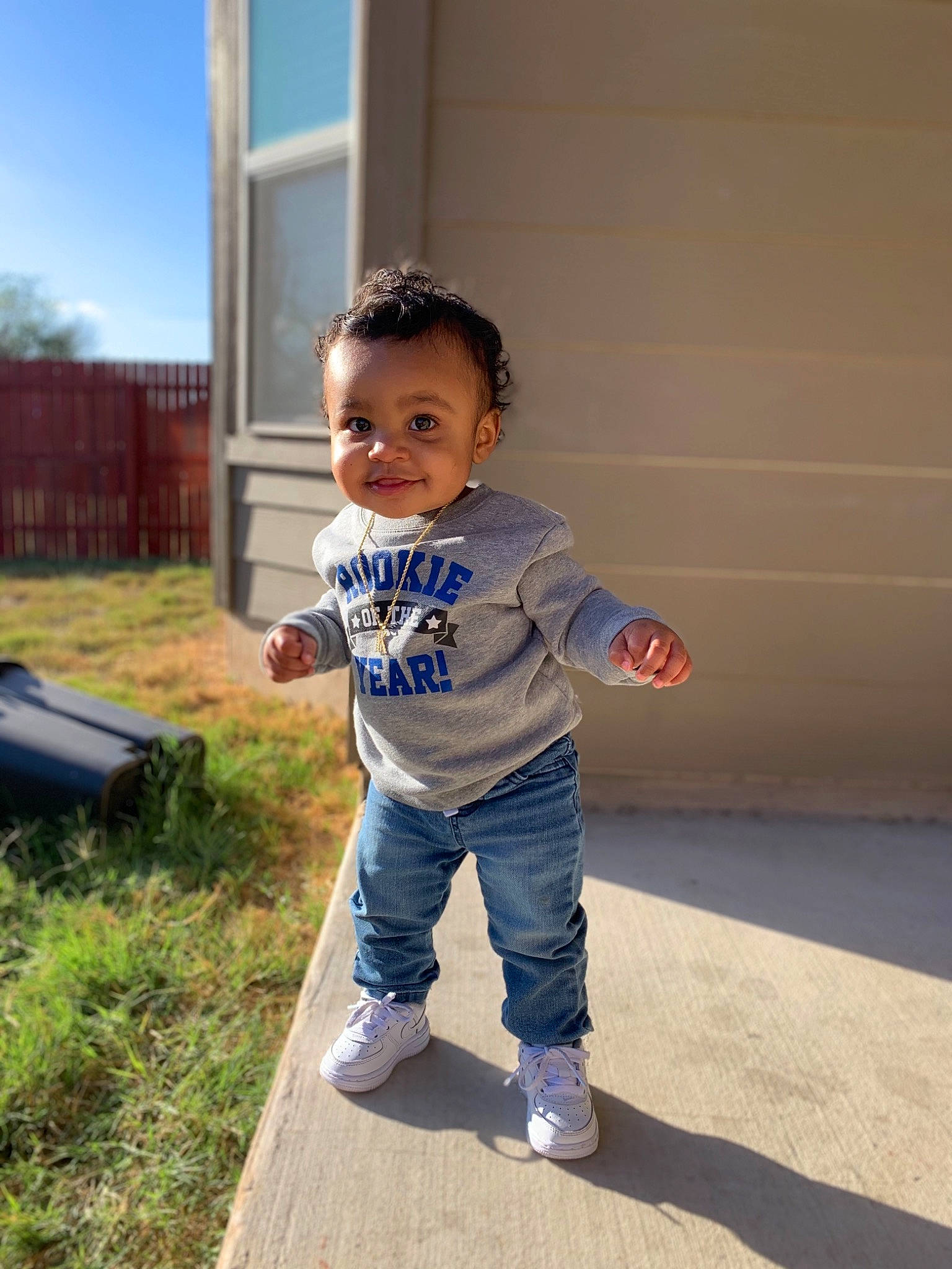 Kyrin joined the competition — help win amazing prizes! baby_toddler_clothing, child, denim, electric_blue, eye, flooring, fun, grass, hair, happy, joy, leisure, person, plant, recreation, sky, sleeve, smile, standing, t_shirt