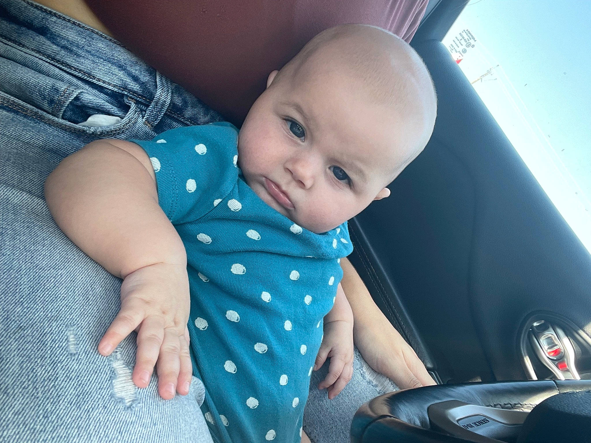 Aubrey is registered to the contest to win money with this photo: automotive_design, automotive_lighting, azure, baby, baby_toddler_clothing, child, comfort, electric_blue, finger, flash_photography, fun, happy, human_body, motor_vehicle, person, sitting, skin, smile, steering_wheel, toddler