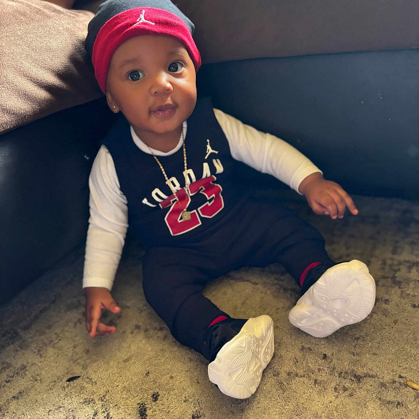 Hasynii Ellerson is registered to the contest to win money with this photo: baseballcap, bodypart, boy, cap, child, clothing, couch, face, finger, footwear, furniture, hand, hat, head, male, pants, person, photography, portrait, sitting