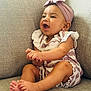 baby, infant, child, couch, furniture, headband, striped_clothing, happy, smiling, sitting, barefoot, indoors, cute, portrait, skin, hands, feet, expression, comfortable, cozy