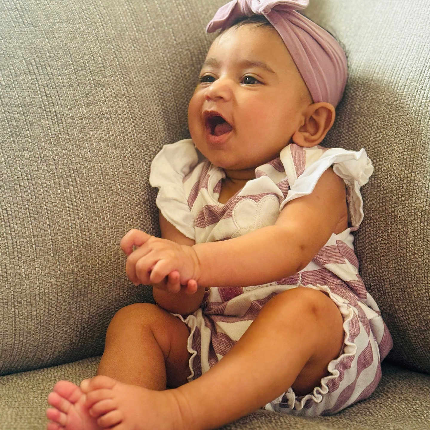 Niyamat joined the competition — help win amazing prizes! baby, barefoot, child, comfortable, couch, cozy, cute, expression, feet, furniture, hands, happy, headband, indoors, infant, portrait, sitting, skin, smiling, striped_clothing