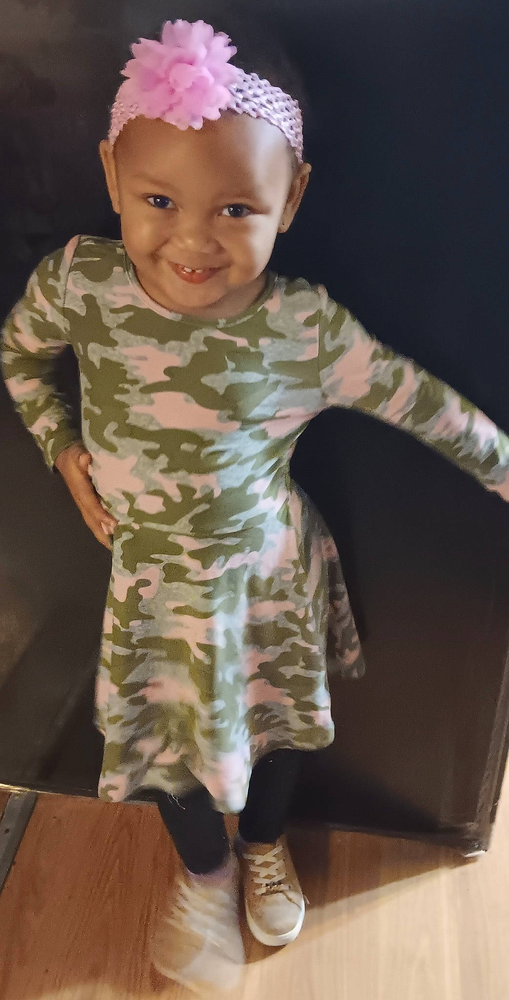 Symphony is registered to the contest to win money with this photo: baby, baby_toddler_clothing, camouflage, child, fun, gesture, happy, headwear, human_leg, joy, military_camouflage, military_uniform, pattern, person, play, sitting, sleeve, smile, t_shirt, thumb