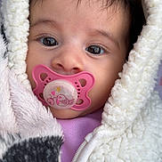 Manel participe au concours pour gagner de l'argent avec cette photo : adorable, baby, baby_girl, child, childhood, close_up, cozy, cute, eyes, face, fleece, hood, infant, jacket, pacifier, pink, portrait, soft_texture, warm_clothing, young_child