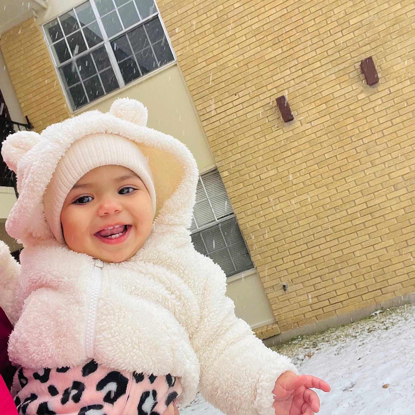 Anairis is registered to the contest to win money with this photo: architecture, brick, building, cap, city, clothing, coat, face, hat, head, hood, jacket, outdoors, person, photography, portrait, road, shelter, street, urban