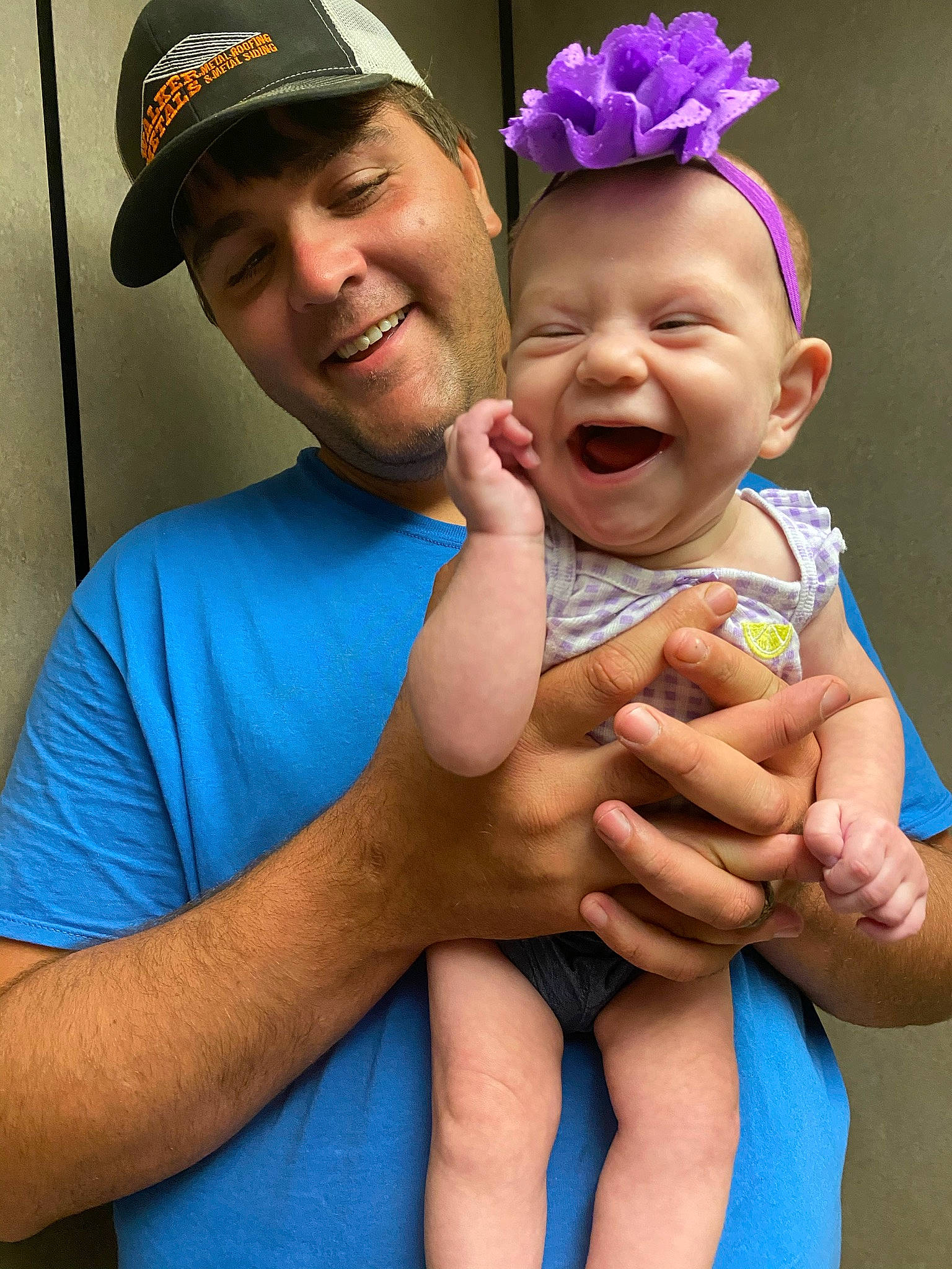 Marleigh is registered to the contest to win money with this photo: baby_toddler_clothing, baseball_cap, blue, cap, face, facial_expression, finger, gesture, hand, happy, headgear, headwear, joy, muscle, organ, person, photograph, product, skin, smile