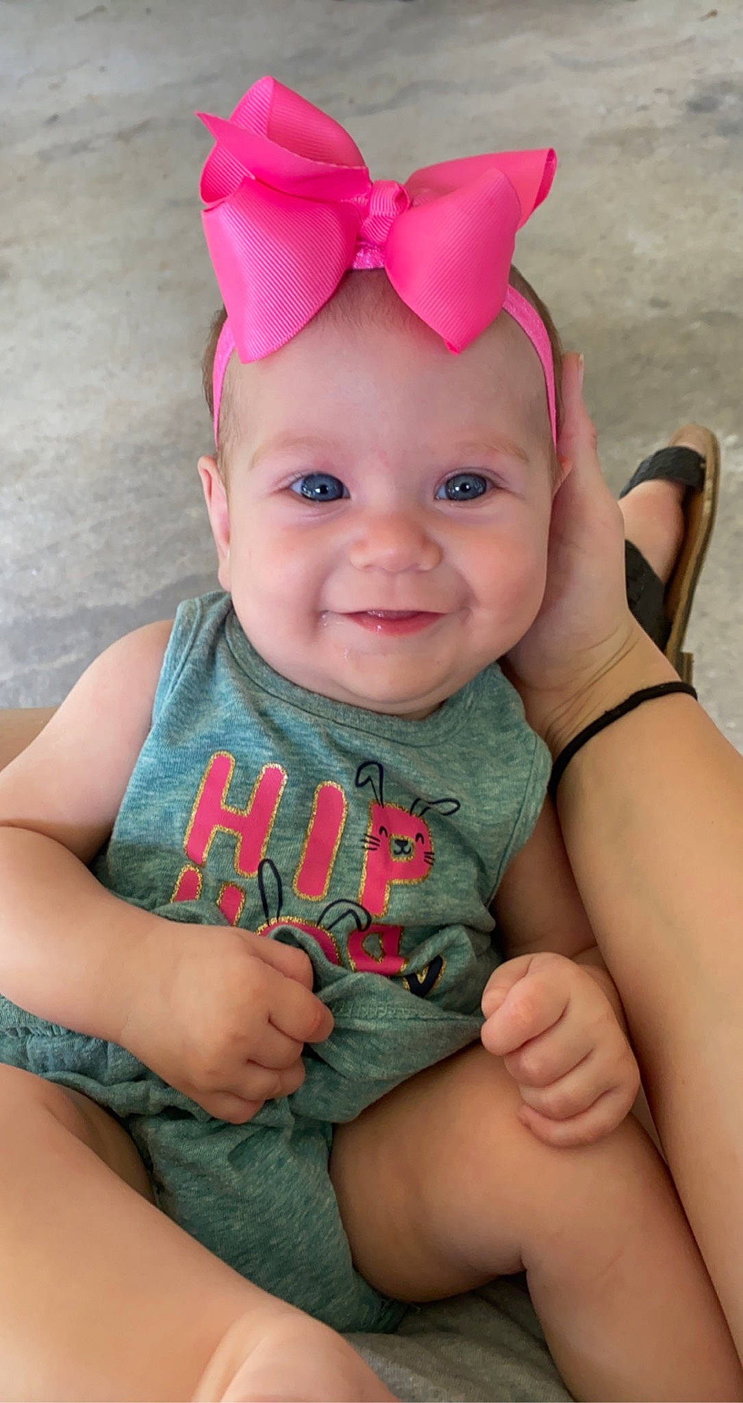 Marleigh joined the competition — help win amazing prizes! baby, baby_toddler_clothing, beauty, cap, cheek, costume_hat, eye, finger, gesture, grass, hand, happy, head, headwear, joy, lip, person, pink, skin, smile