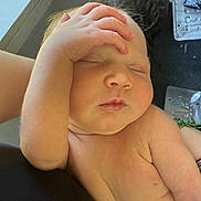 Norah is registered to the contest to win money with this photo: baby, sleeping, hand, face, skin, infant, peaceful, closeup, arm, resting, portrait, cute, child, newborn, expression, soft_light, indoors, person, relaxation, toddler